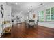 Spacious dining area leading to a modern kitchen, ample natural light, and bar cart accent at 958 Crew Sw St, Atlanta, GA 30315