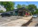 Exterior view of Poach Social establishment with parking and outside seating at 958 Crew Sw St, Atlanta, GA 30315
