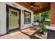 Covered front porch with a swing and seating area at 958 Crew Sw St, Atlanta, GA 30315