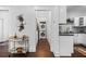 Hallway featuring a decorative bar cart and access to the laundry room and kitchen at 958 Crew Sw St, Atlanta, GA 30315
