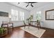 Bright and airy home office featuring wood floors, shutters, and a green plant at 958 Crew Sw St, Atlanta, GA 30315