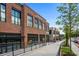 Exterior view of retail shops with brick facade and ample window space, plus adjacent street parking at 958 Crew Sw St, Atlanta, GA 30315