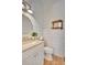 Elegant powder room with a modern vanity, shiplap accent wall, and stylish fixtures at 11190 Serenbe Ln, Chattahoochee Hills, GA 30268