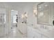 Luxurious bathroom with marble countertops, dual vanities, and a glass-enclosed shower at 11190 Serenbe Ln, Chattahoochee Hills, GA 30268