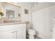 Well-lit bathroom with a vanity, toilet, and shower/tub combo featuring modern fixtures at 11190 Serenbe Ln, Chattahoochee Hills, GA 30268