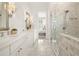 Bright bathroom with a marble-topped vanity, and a glass enclosed shower at 11190 Serenbe Ln, Chattahoochee Hills, GA 30268