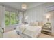 Serene main bedroom with large windows offering scenic views and soothing neutral tones at 11190 Serenbe Ln, Chattahoochee Hills, GA 30268
