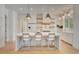Bright kitchen with large island, modern appliances, and ample counter space at 11190 Serenbe Ln, Chattahoochee Hills, GA 30268
