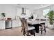 Well-lit kitchen featuring stainless steel appliances, granite countertops, and a stylish breakfast bar at 11190 Serenbe Ln, Chattahoochee Hills, GA 30268
