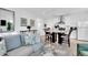 Open-concept living space featuring contemporary decor and seamless flow to the dining area and kitchen at 11190 Serenbe Ln, Chattahoochee Hills, GA 30268