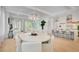 Open-concept living space with modern kitchen, dining area, and comfortable seating at 11190 Serenbe Ln, Chattahoochee Hills, GA 30268