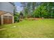 Well-maintained backyard with a storage shed and mature landscaping at 3389 Robinson Farms Ne Trce, Marietta, GA 30068