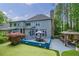 Aerial view of the backyard with a stone patio, putting green, and gazebo-covered seating area at 3389 Robinson Farms Ne Trce, Marietta, GA 30068