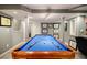 Basement featuring a well-lit billiards table with blue felt, ready for a game of pool at 3389 Robinson Farms Ne Trce, Marietta, GA 30068