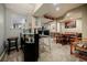 Finished basement featuring a wet bar with seating, a game table, and carpet flooring at 3389 Robinson Farms Ne Trce, Marietta, GA 30068