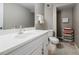 Finished basement bathroom featuring vanity with white countertop and tile flooring at 3389 Robinson Farms Ne Trce, Marietta, GA 30068