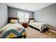 Shared bedroom featuring two twin beds, coordinated bedding, and carpeted floors for a cozy feel at 3389 Robinson Farms Ne Trce, Marietta, GA 30068