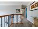 A hallway on the second floor with blue doors, white trim, and carpeted floor at 3389 Robinson Farms Ne Trce, Marietta, GA 30068