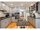 Kitchen featuring gray cabinets, granite countertops, a wine rack, and modern stainless steel appliances at 3389 Robinson Farms Ne Trce, Marietta, GA 30068