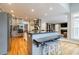 Open-concept kitchen with breakfast bar provides sight lines to the living area at 3389 Robinson Farms Ne Trce, Marietta, GA 30068
