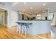 Open concept kitchen features a breakfast bar, stainless appliances, and light gray cabinets at 3389 Robinson Farms Ne Trce, Marietta, GA 30068