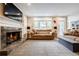 Bright living room with a fireplace, large windows, and comfortable seating at 3389 Robinson Farms Ne Trce, Marietta, GA 30068