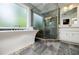 The main bathroom features a large tub, a large stand-up shower, and marble floors at 3389 Robinson Farms Ne Trce, Marietta, GA 30068