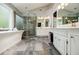 The main bathroom features a large tub and shower, double sinks, and marble floors at 3389 Robinson Farms Ne Trce, Marietta, GA 30068