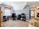 A home office featuring a window, an office chair, desk and storage, and light-blue walls at 3389 Robinson Farms Ne Trce, Marietta, GA 30068