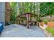 Outdoor patio features a covered gazebo with seating and lush green surroundings at 3389 Robinson Farms Ne Trce, Marietta, GA 30068
