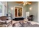 Cozy sunroom with wicker chairs and a mini refrigerator at 3389 Robinson Farms Ne Trce, Marietta, GA 30068