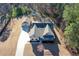 Aerial view of a gray house with a long driveway and a detached two-car garage at 510 Boulder View Parkway, Dallas, GA 30157