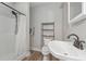 Bathroom featuring a modern sink, shower, and toilet with wood grain flooring at 510 Boulder View Parkway, Dallas, GA 30157