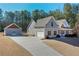 Charming home with an attached garage, a separate building, and a long, concrete driveway at 510 Boulder View Parkway, Dallas, GA 30157
