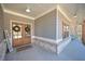 Covered front porch featuring wood columns, wood doors, and brick accents at 510 Boulder View Parkway, Dallas, GA 30157