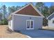 Detached two-car garage with matching siding and roofing, plus carriage doors at 510 Boulder View Parkway, Dallas, GA 30157