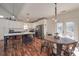 Modern kitchen with island seating, stainless appliances, and adjacent breakfast area with outdoor access at 510 Boulder View Parkway, Dallas, GA 30157