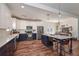 Spacious kitchen with island, stainless steel appliances, white cabinetry, and adjacent dining area at 510 Boulder View Parkway, Dallas, GA 30157