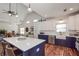 Open living space with kitchen featuring an island, dining area, and living room with vaulted ceilings at 510 Boulder View Parkway, Dallas, GA 30157