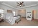 Spacious primary bedroom with a large bed, tray ceiling, and ample natural light at 510 Boulder View Parkway, Dallas, GA 30157