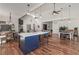 Open-concept kitchen, dining, and living area with hardwood floors, island seating, and comfortable layout at 510 Boulder View Parkway, Dallas, GA 30157