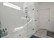 Modern bathroom glass shower with a rain shower head and tile flooring at 510 Boulder View Parkway, Dallas, GA 30157