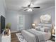 Comfortable bedroom featuring a ceiling fan, TV, and a door to the outside at 602 Country Park Se Dr, Smyrna, GA 30080