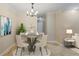 Cozy dining area with modern chandelier and seating for four at 602 Country Park Se Dr, Smyrna, GA 30080