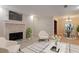 Neutral living room highlighting the stone fireplace, adjacent dining area, and modern decor at 602 Country Park Se Dr, Smyrna, GA 30080