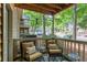 Relaxing outdoor patio area with comfortable seating, trees, and view of the community at 602 Country Park Se Dr, Smyrna, GA 30080