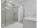 Modern bathroom with marble tiled shower, glass door, and sink with stylish fixtures at 1080 Westmont Sw Rd, Atlanta, GA 30311