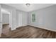 Bedroom featuring wood-look flooring, closet and a window at 1080 Westmont Sw Rd, Atlanta, GA 30311