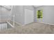 Bright bedroom with neutral walls, carpeted floor, and a closet, offering a calm and inviting atmosphere at 1080 Westmont Sw Rd, Atlanta, GA 30311