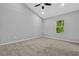 Bright bedroom with neutral walls, carpeted floor, and a ceiling fan, offering a calm and inviting atmosphere at 1080 Westmont Sw Rd, Atlanta, GA 30311